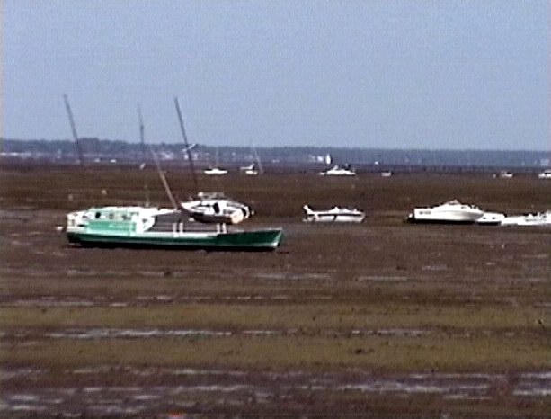 Dry parking boats during low tide. On our way to beach we saw these boats anchoring far from the shore.