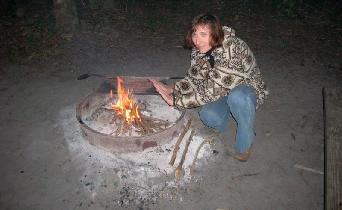 Milena is warming up at campfire. (December 2005) Milena is warming up at campfire. (December 2005)