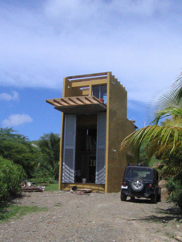 Neighbour's house offers a view to the sea from above the rooftop