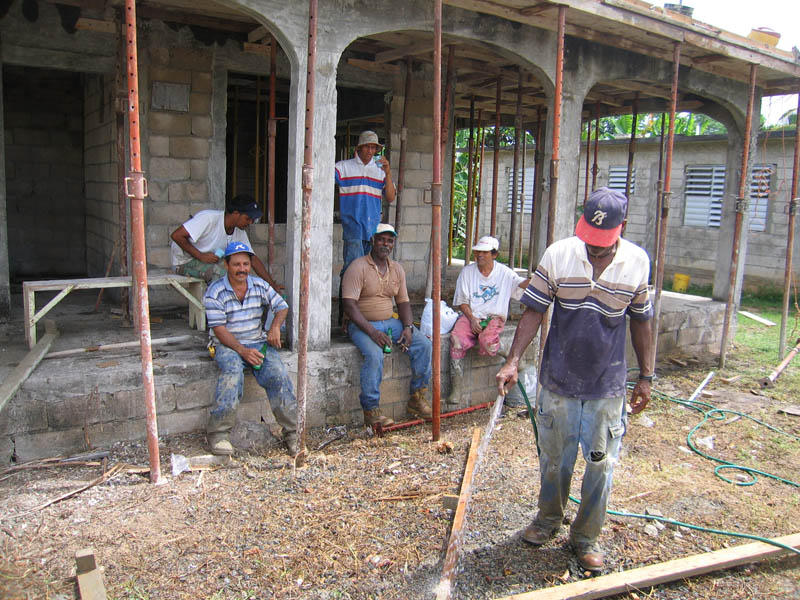 Pablo Brache Castro with his staff resting while waiting for the last load of concrete. (July 2006)