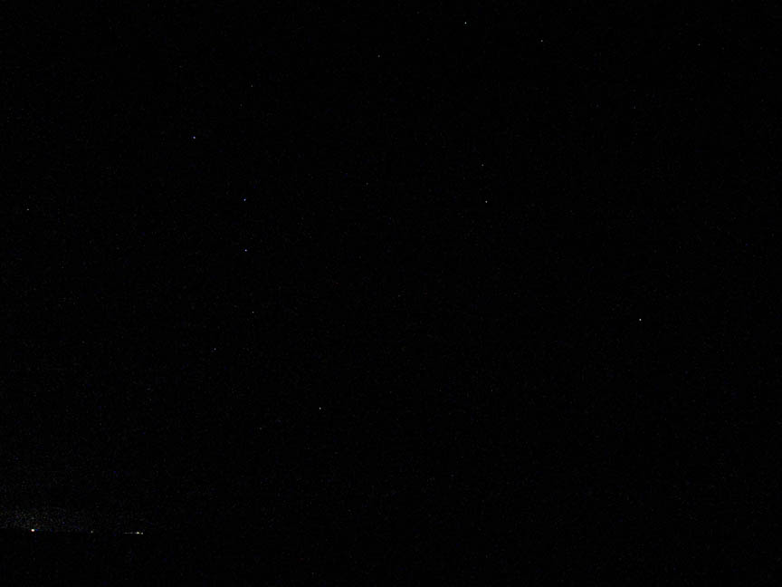 Ursa Major and Ursa Minor over the Caribbean horizon. (Open the picture in full size to see the stars)