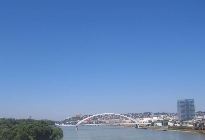 The Bratislava's newest Apollo bridge as seen from another bridge. The Castle of Bratislava at a distance.