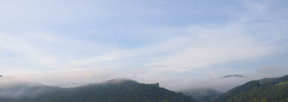 Šášov Castle and Štiavnica Hills in a morning haze