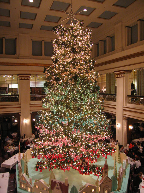 Three stories high restaurant with Christmas tree in the middle