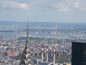 La Guardia Airport at the distance (cca 6 miles) behind the top of the Chrysler Building (August 2008) La Guardia Airport at the distance (cca 6 miles) behind the top of the Chrysler Building (August 2008)