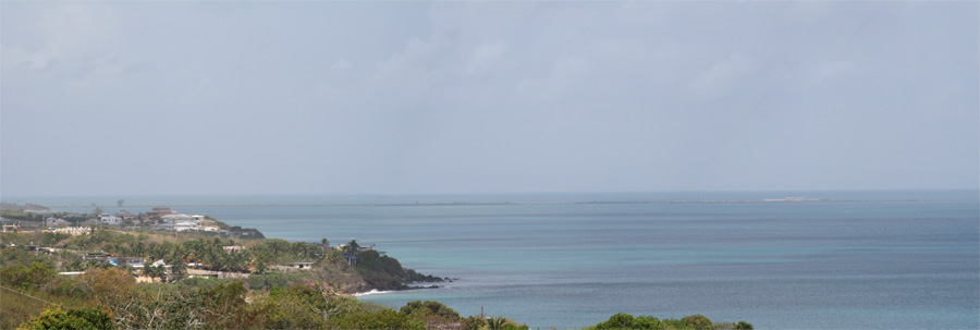 The narrow strip in the sea just below the horizon, that's the Mosquito Pier (more than a mile long, about 5 miles from here)