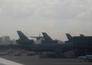 Lockheed C-130 Hercules landing next to the parked KC-10 Extenders (April 2009) Lockheed C-130 Hercules landing next to the parked KC-10 Extenders (April 2009)