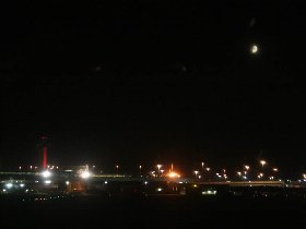 Moon above New York and a color changing control tower (July 2009) Moon above New York and a color changing control tower (July 2009)