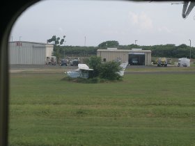 Small airplane "parked" next to runway (August 2010)