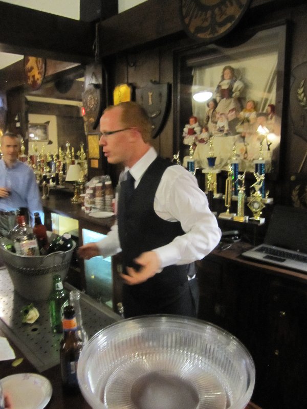 The groom enjoying bartending