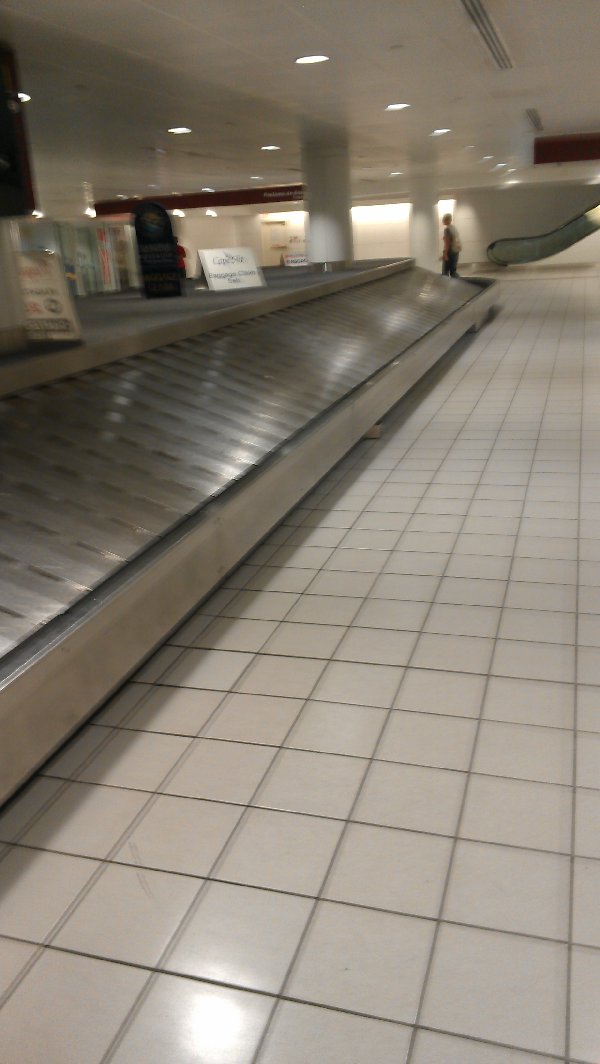 After a while, the conveyor stopped and there were still 3 people without their luggage (including us)