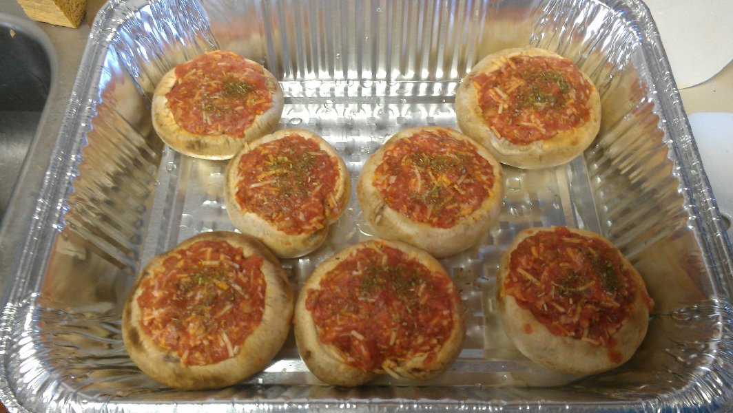 Portobello mushrooms are stuffed, ready for baking