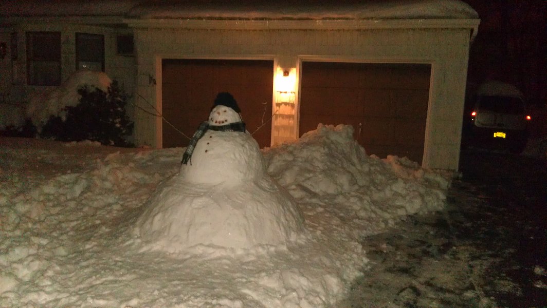 Cesar cleaned some snow - amazing idea to make a heap and a big snowman in front of my garage...