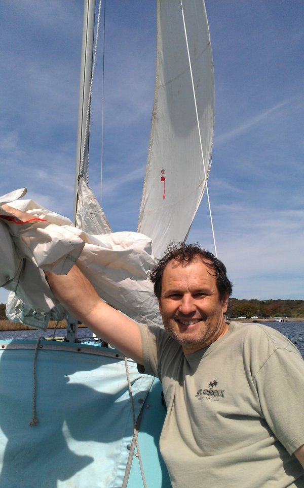 Furling the main sail as we are nearing the dock