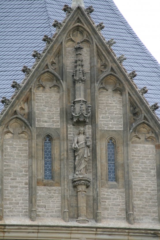 St. Barbora, the patron of miners (and of the town of Kutn Hora), at the honorable place on top of the church's front facade