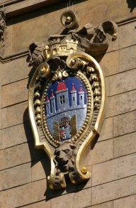 One of the coat-of-arms at Česká spořitelna building (June 2014) One of the coat-of-arms at Česká spořitelna building (June 2014)
