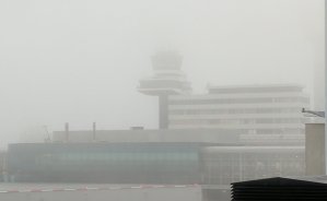 The main control tower is not visible in the fog - it's only about 200 ft behind this small one (which itself is some 70 ft from me) (December 2016) The main control tower is not visible in the fog - it's only about 200 ft behind this small one (which itself is some 70 ft from me) (December 2016)