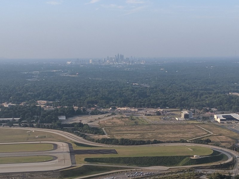 Departing from the world busiest airport - Downtown Atlanta at the distance