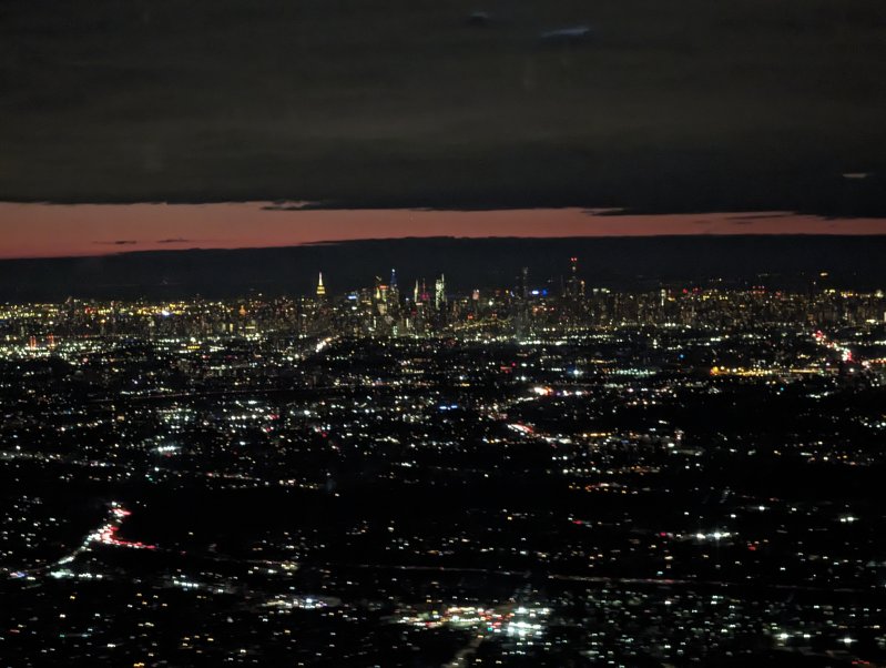 Manhattan lights at a distance as we are approaching on JFK airport