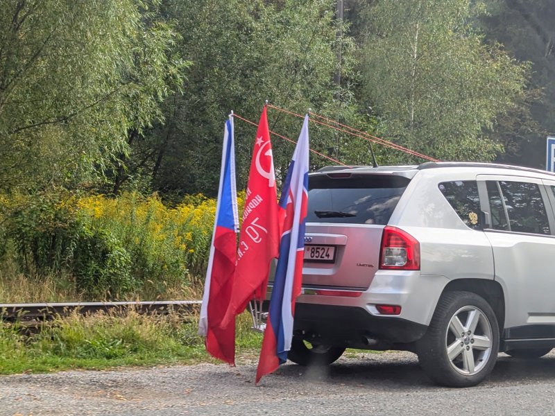 The Victory Banner between Czech and Slovak flags