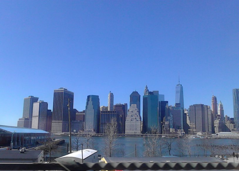View to Downtown Manhattan from the other side, from Brooklyn from car on Brooklyn Queens Expy