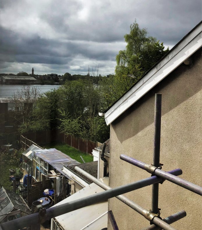 A view from the window to the reservoir (and neighbor's loaded backyard)