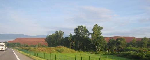 iar nad Hronom - the manmade hill of waste from aluminium producing factory. Real mountains visible at the distant horizon. (August 2006)