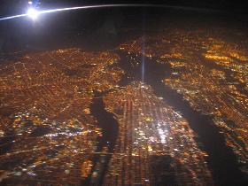 ...midnight arrival to New York. Nicely visible bridges as well as ships anchored in the bay. (September 2007)