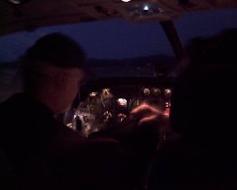 Evening departure from Vieques - worth mentioning is that the one who helps to hold flight documents for pilot is just a passenger too (July 2008)