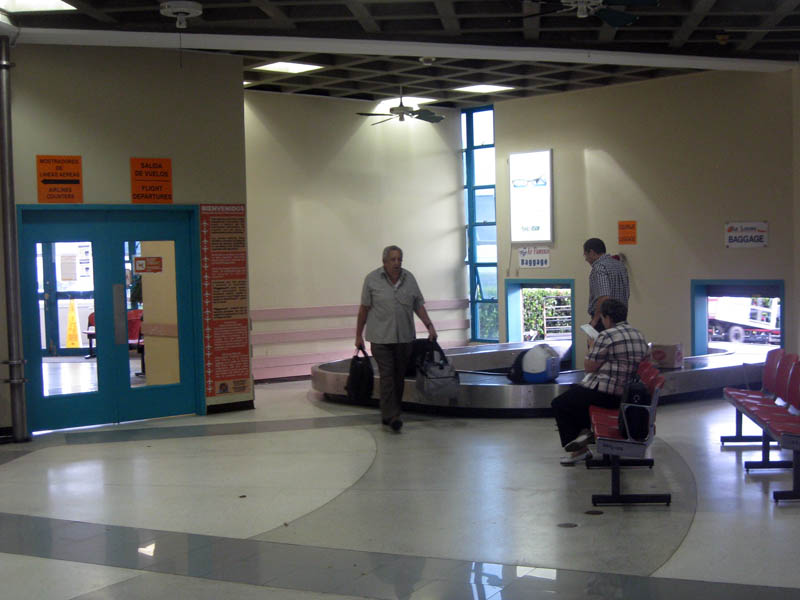 The VQS international airport has everything what an international airport is supposed to have - arrival area (in the foreground), baggage claim (not the biggest ever), and departure area (behind the door at left, almost as big as this arrival hall) (August 2009)