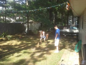 Boys preparing wood for the fire (August 2015)