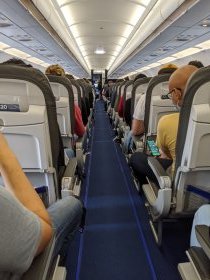 At the London airport, they were taking temperature of folks entering airplane...the airplane that went to Italy. Not ours. Weird. This airplane is full - just few free spaces. (June 2020)