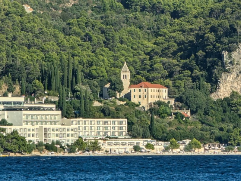 Hotel and Franciscan monastery in the next village of ivogoe as seen from our beach (August 2024)