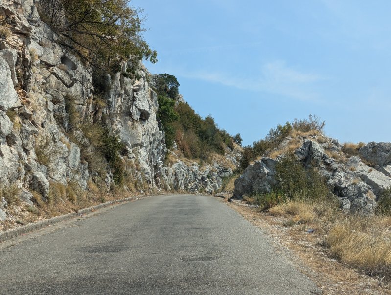 The road crosses the mountain saddle just a few hundred yards from the Albanian border (August 2024)